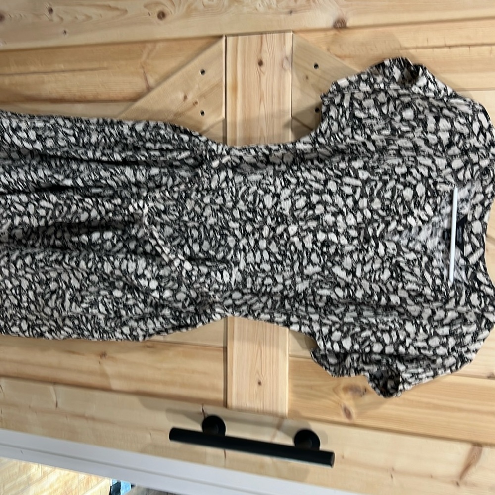 Cream, black and gray patterned dress.  Midlength with cap sleeves and tie-waist